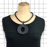 Reverse side of Perspex O necklace showing matte black finish by Frank Ideas