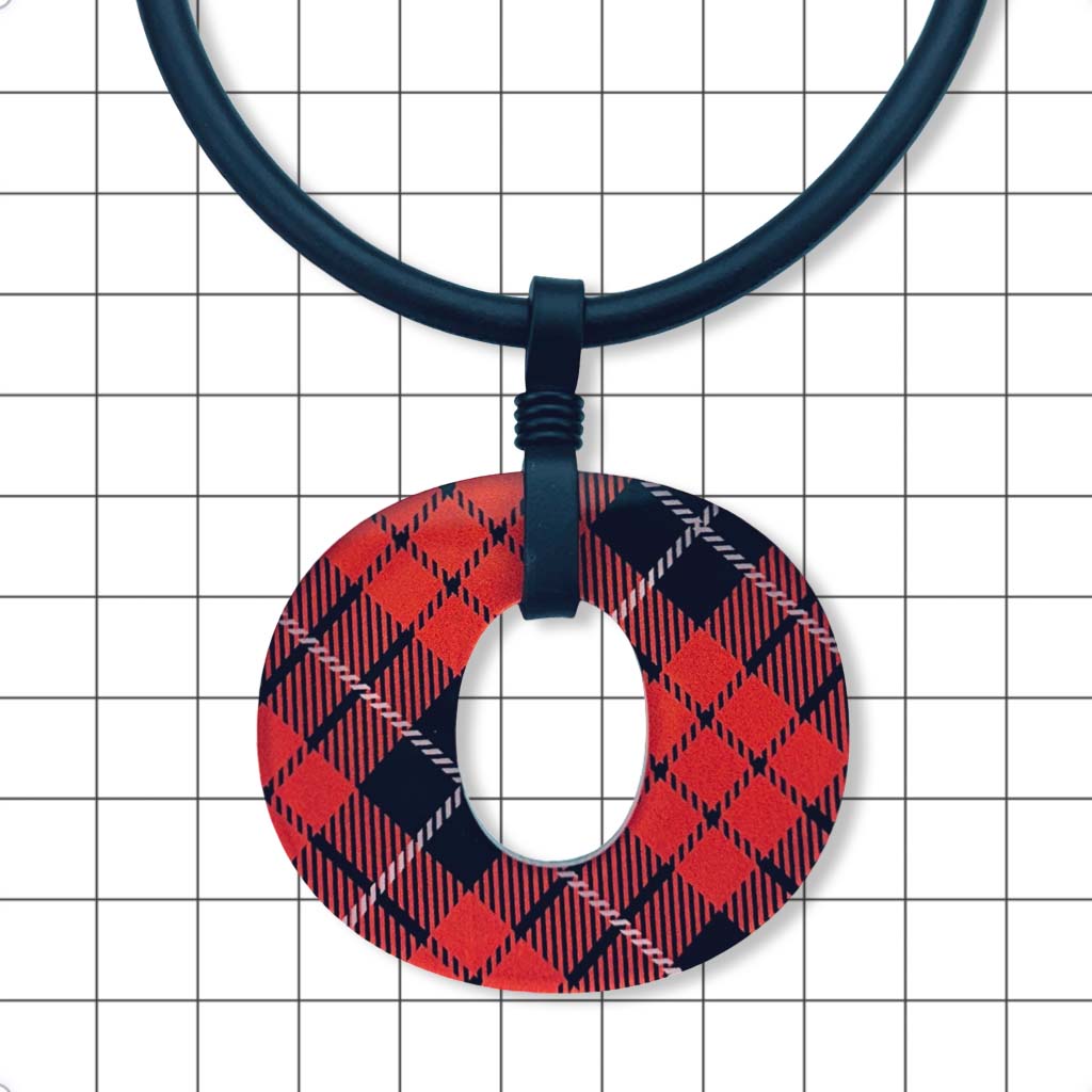 Close-up of gloss red and black tartan Perspex O pendant by Frank Ideas