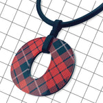 Close-up detail of gloss red and black tartan Perspex O pendant by Frank Ideas