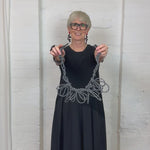 black and white textile necklace demonstration in a video