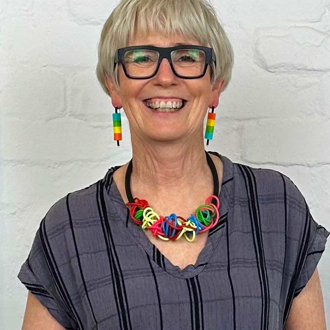 rainbow tangled necklace worn by a woman