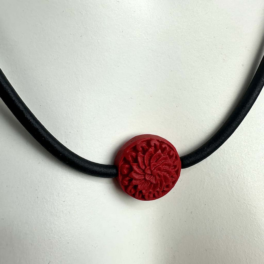 short single bead and thin rubber necklace -red, carved Cinnabar bead