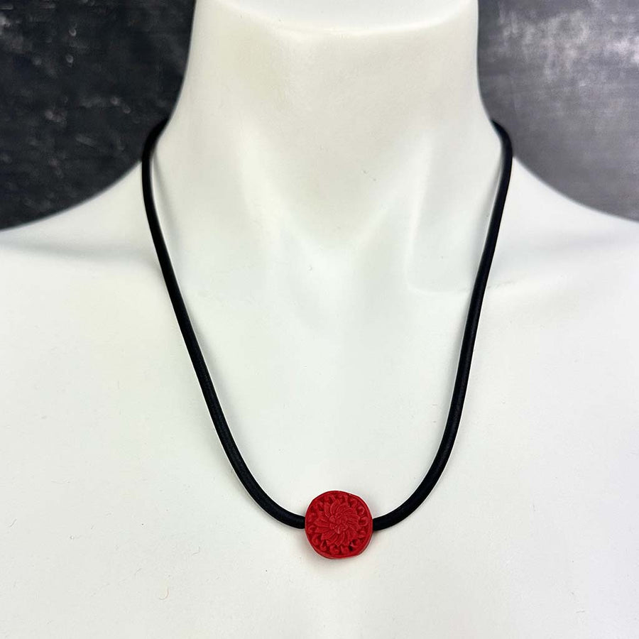 short single bead and thin rubber necklace -red, carved Cinnabar bead