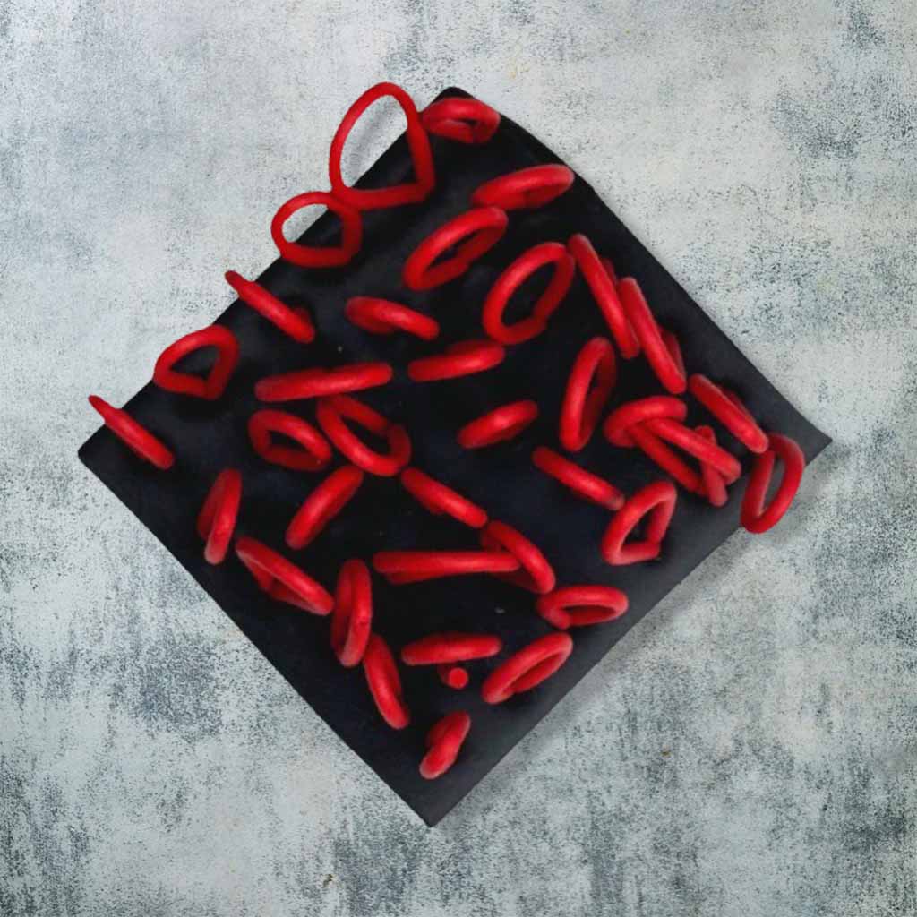 red and black rubber brooch with loops