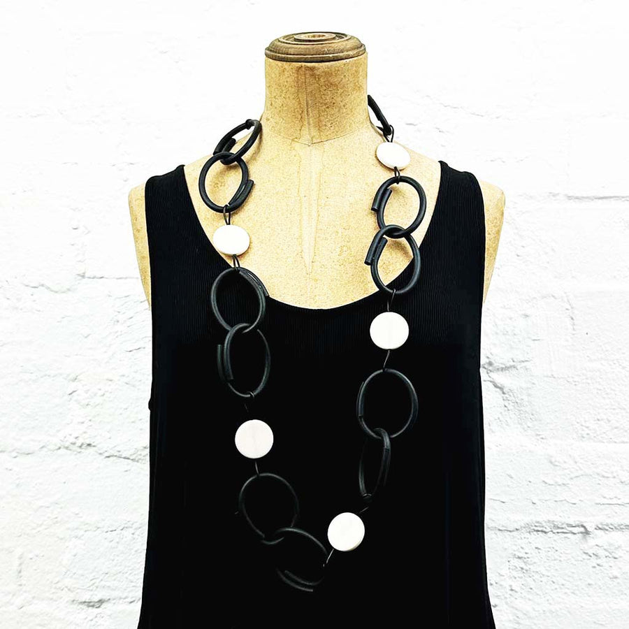 Resin and rubber long chain necklace black with white dots