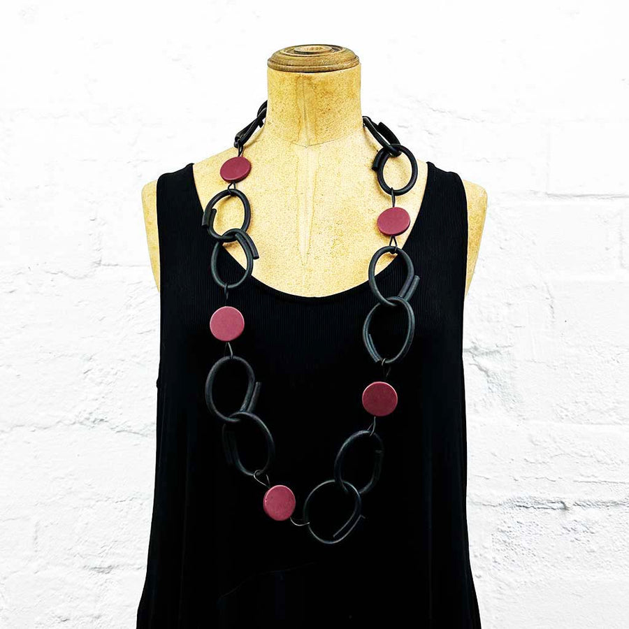 Resin and rubber long chain necklace black with red dots