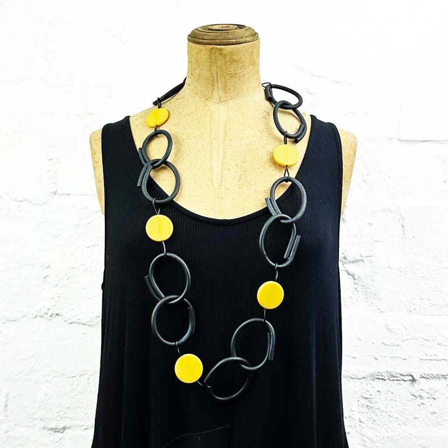 Resin and rubber long chain necklace black with yellow dots