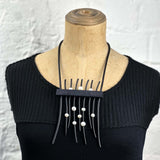show stopper rubber and pearl necklace
