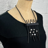 show stopper rubber and pearl necklace