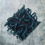 black and teal rubber brooch with loops