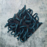 black and teal rubber brooch with loops