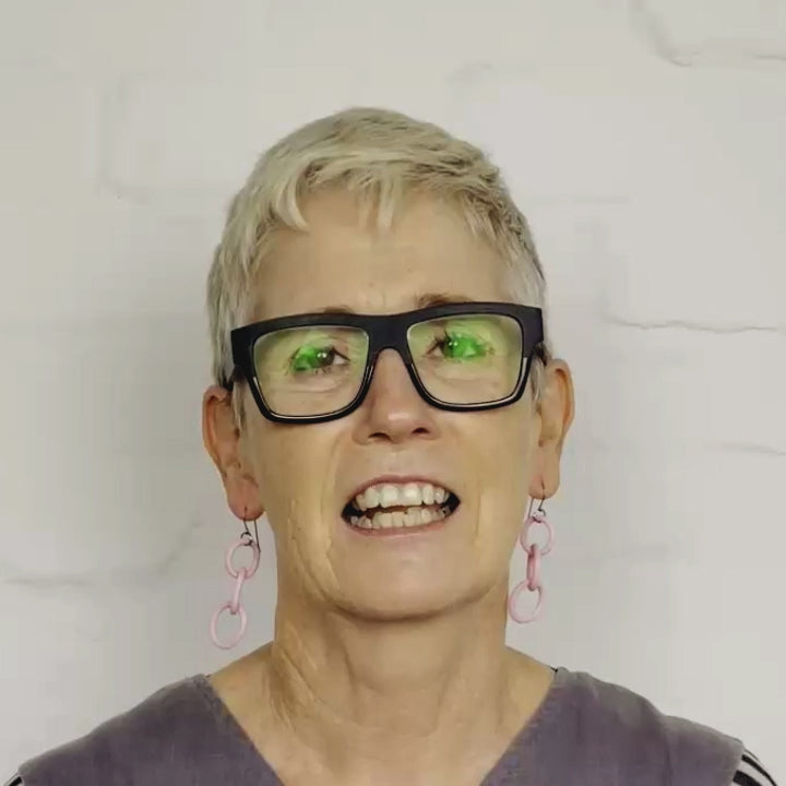 video of rowan showing the chain drop earrings