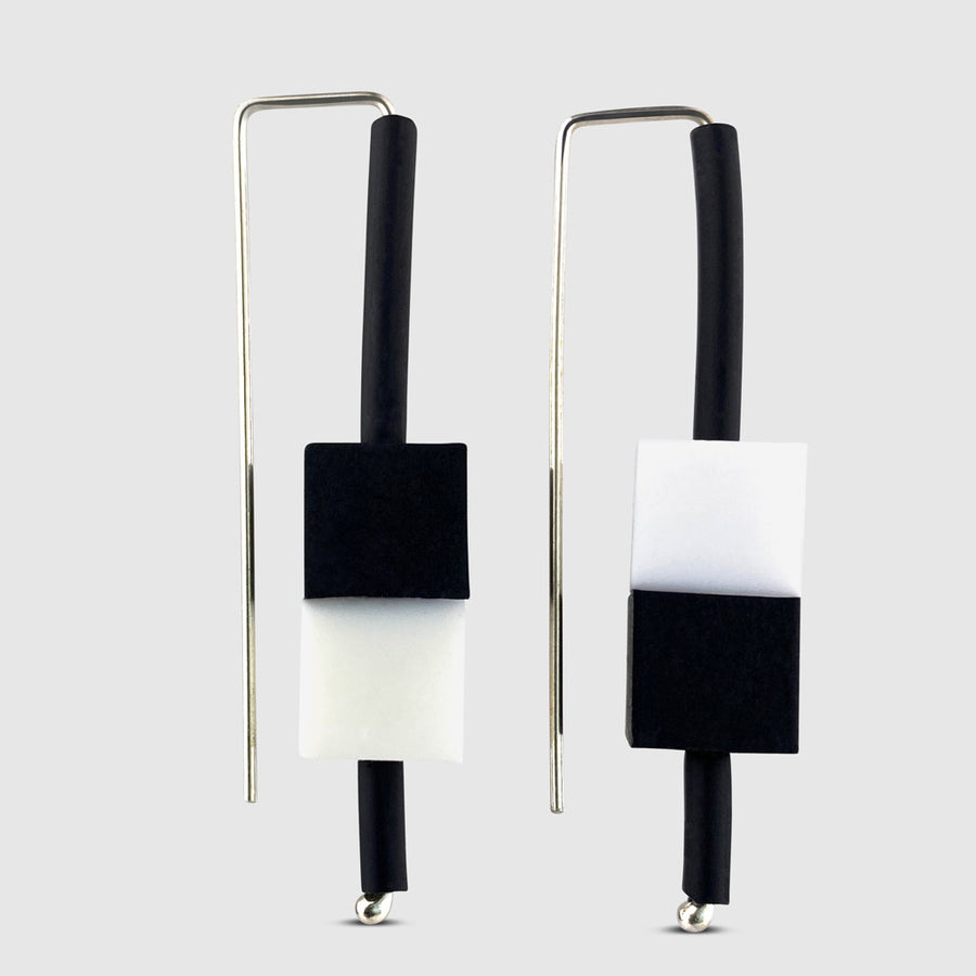 black and white rubber cube earrings on serling silver