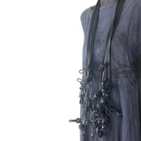 long black rubber necklace on a mannequin