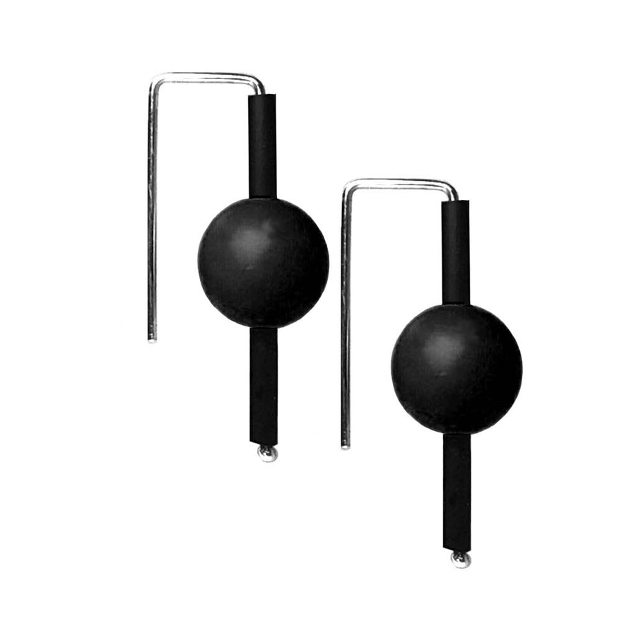 Black rubber earrings made with sterling silver. Bold, fun design.