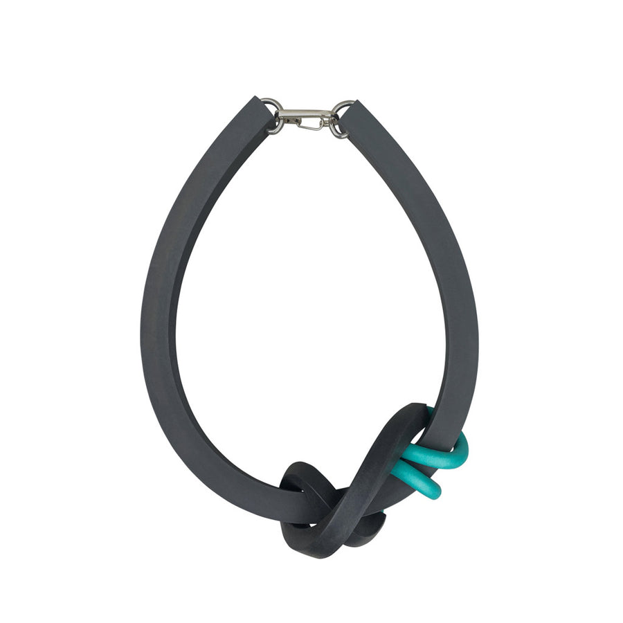 black and teal knot necklace on a white background