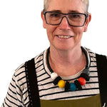 rowan shaw the designer for Frank Ideas wearing the short chunky, multi colored resin necklace