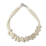 white/cream twist necklace on a white background