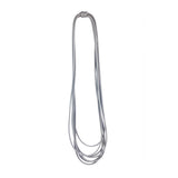 long grey rubber necklace on a white background