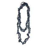 Edgy, long tangled black rubber necklace.