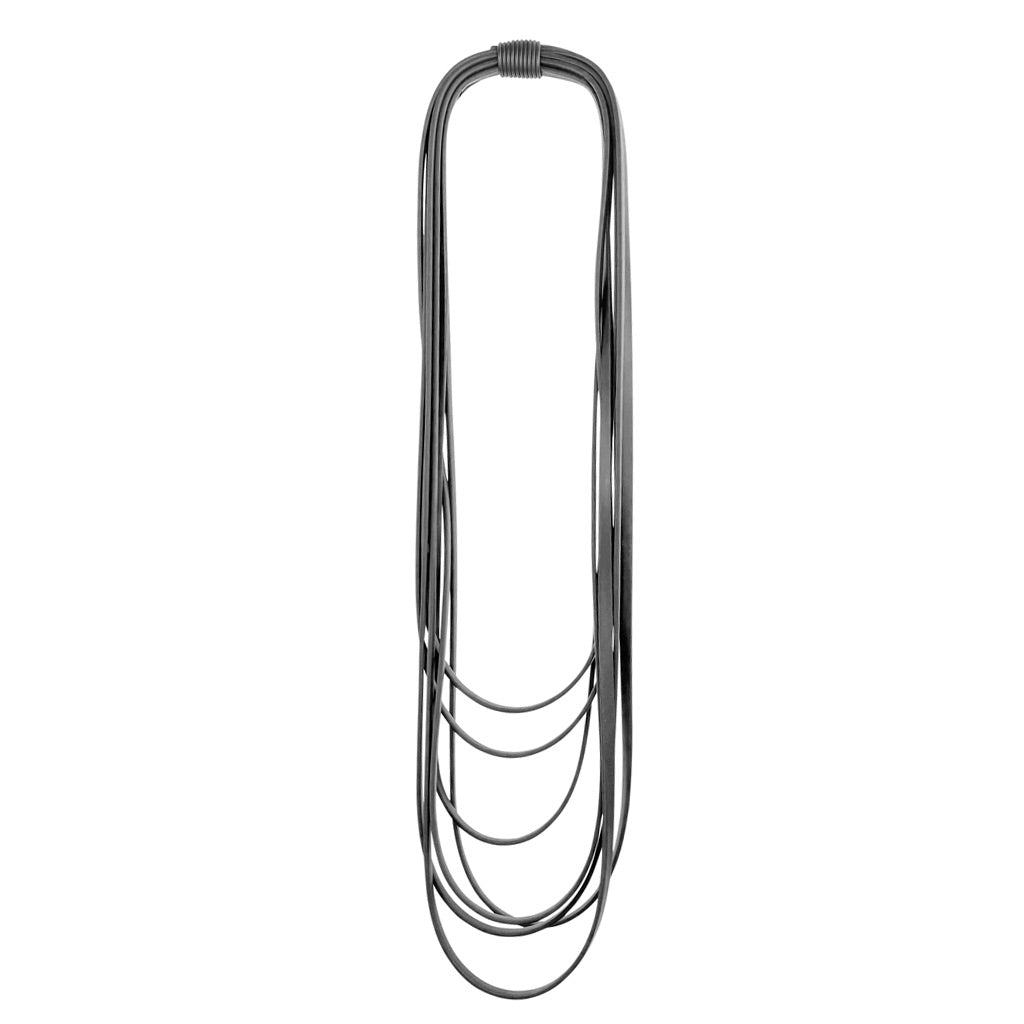 black layered rubber necklace on a white background