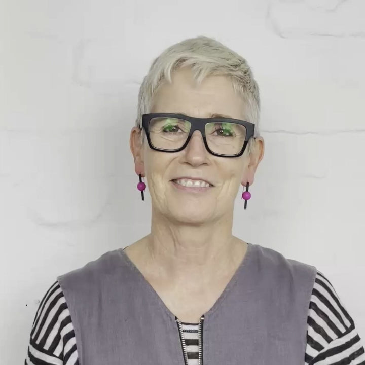 video of woman wearing modern rubber earrings