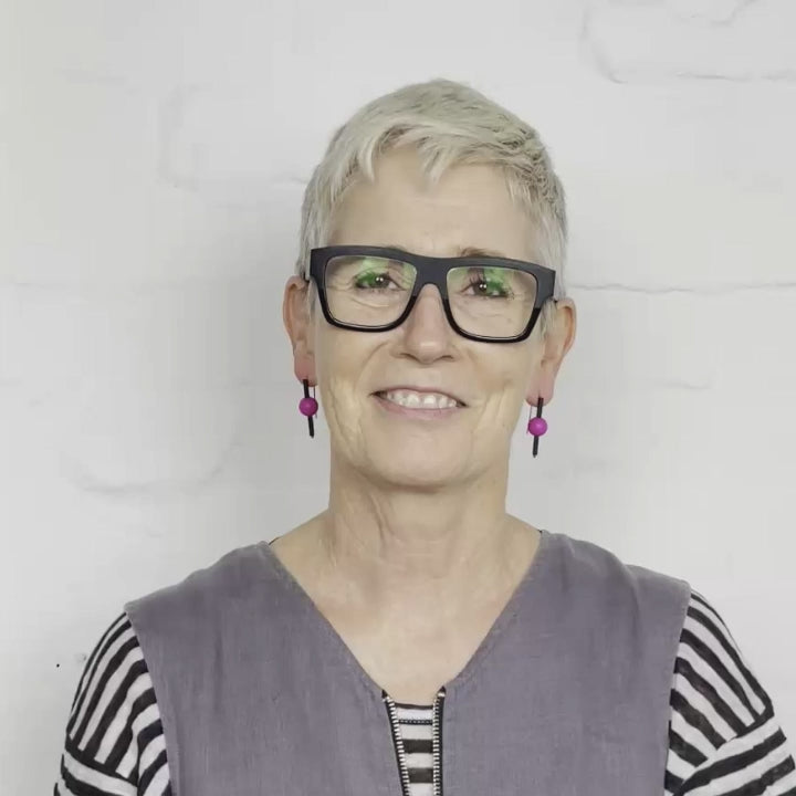 video of woman wearing modern rubber earrings