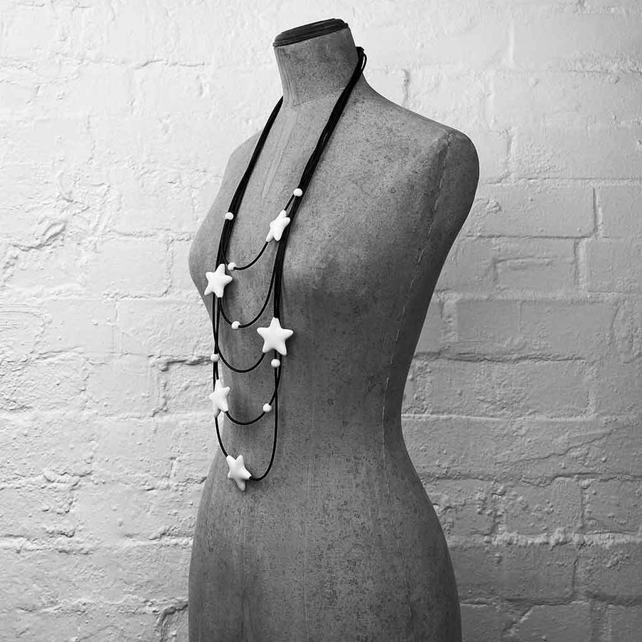 white star necklace on a mannequin
